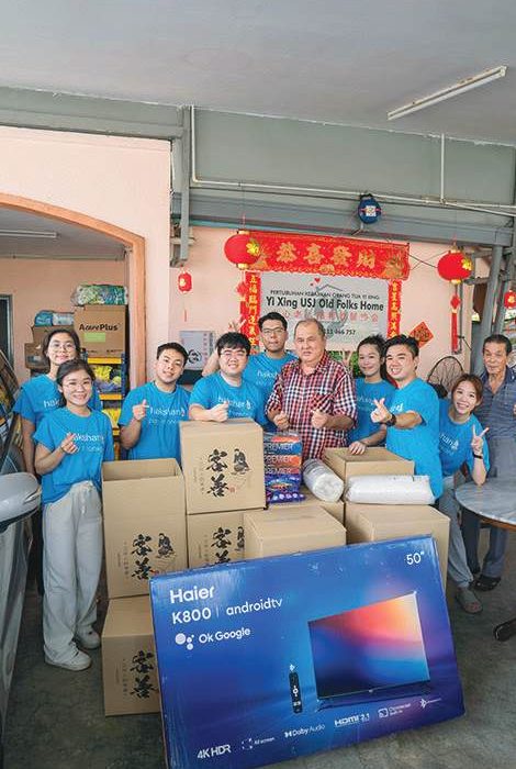 The HAKSHAN team delivering care packages to a community partner